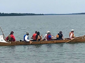 Canoes for Conservation employs a voyageur canoe like this one above off St. Joseph Island in its tourist promotion.