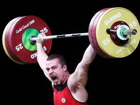 Boady Santavy of Sarnia, Ont., competes in the men's 94-kg final during weightlifting on Day 4 of the Gold Coast 2018 Commonwealth Games at Carrara Sports and Leisure Centre on April 8, 2018, on the Gold Coast, Australia.  (Photo by Hannah Peters/Getty Images)