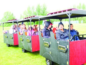 Celebrating Canada Day
Rain or shine, the City of Beaumont kept the festivities going to bring in Canada's 152nd birthday at Four Seasons Park on July 1, 2019. People gathered under the white tent where there was kids' activities, a photobooth and cake served. The rain did not stop some from enjoying the inflatable obstacle courses and train rides while those who stayed dry watched Magician Kent Wong, among other acts. (Nykole King)