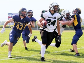 Chatham-Kent Cougars' Logan Stefina (24) is chased by Sault Sabercats' Aaron Grandinetti (43) in the second half of the Ontario Football Conference's West Division junior varsity final the Chatham-Kent Community Athletic Complex on July 28, 2019. Mark Malone/Chatham Daily News