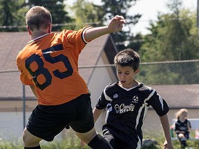 Isaac Woodward puts the moves on his opponent during a weekend soccer tournament in Timmins