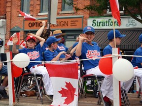 The Stratford Memorials Softball team rides on the Stratford Royal Canadian Legion float during the city's last Canada Day Parade in 2019. Galen Simmons/Beacon Herald file photo