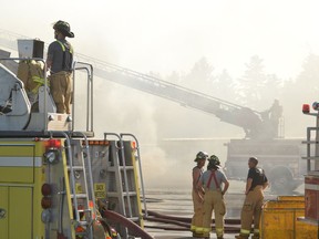 A firefighter can be seen in this Beacon Herald file photo working from the rear of Stratford's current aerial fire truck, which, at 29 years old, is due for replacement. Beacon Herald file photo