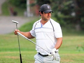 PETER RUICCI
Frank Kucher sizes up a putt on the 18th green at Root River Golf Club.