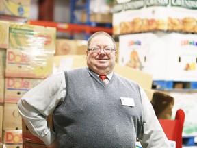 Dan Xilon, executive Director of the Sudbury Food Bank, stands in the packed warehouse.