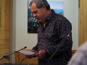 Coun. Andrew Poirier reads the release on the changes made to the Kenora Non Profit Housing board at city council Tuesday, July 16. Poirier was already on the board prior to the changes.
