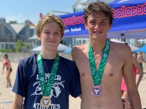 Clarke Denomy, left, and Kaden Reid won silver medals at an Ontario Volleyball Association beach tournament in Port Stanley, Ont., on Saturday, July 27, 2019. (Contributed Photo)