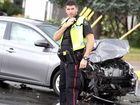 Police and firefighters respond to a two-vehicle collision at Wellington Street East and Simpson Road on Wednesday, Aug. 7, 2019. (BRIAN KELLY/THE SAULT STAR/POSTMEDIA NETWORK)