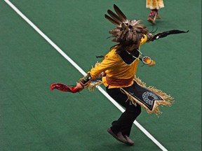 The Jimerson family performs a dance in the second-period intermission. They also performed a smoke dance during the pre-game ceremony and were joined by players from Akwesasne and Six Nations, on Wednesday August 7, 2019 in Akwesasne, Ont. Nick Dunne/Cornwall Standard-Freeholder/Postmedia Network