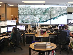Communications officers from Kingston Police's C Platoon at the force's Communications Centre in Kingston, Ont., on Wednesday, August 21, 2019. Steph Crosier/The Whig-Standard/Postmedia Network