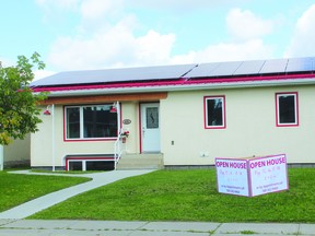 This 1963 refitted bungalow features straw bale insulation in its walls and solar panels on the roof.