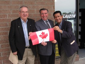 Order of Canada recipients Jake Lamoureux, left, and Sultan Jessa, right, join Stormont-Dundas-South Glengarry MP Guy Lauzon at the kickoff of the "Proud to be Canadian" campaign in Cornwall in this file photo from 2006.