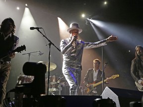 Gord Downie, centre, and The Tragically Hip perform in concert at Rexall Place in Edmonton on July 28, 2016., as part of the band's final concert tour. (Larry Wong/Postmedia Network)