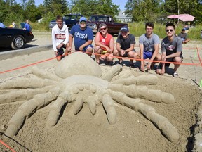 The winning family entry at Sauble Sandfest, a spider, by the Freitag family and their friends, of Burlington, Ont. From the left, Blair Chadwick, 17, Eric Freitag, Brian Freitag, 20, Gavin Freitag, 16, Cameron Smith, 17, and Kevin Liu, 17, on Saturday, August 10, 2019 in Sauble Beach, Ont. Scott Dunn/The Owen Sound Sun Times/Postmedia Network