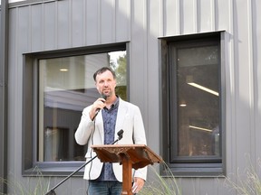 Graham Cubitt, director of projects for InDwell, speaks at the opening of Blossom Park Apartments in Woodstock on Tuesday, Aug. 20, 2019.