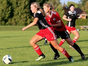 Chatham FC's Taryn Dudley, left, is chased by Jen Kerkhof of the German Canadian FC Blaze in a First Division game in the London & Area Women's Soccer League at St. Clair College's Chatham Campus in Chatham, Ont., on Wednesday, Aug. 14, 2019. Mark Malone/Chatham Daily News/Postmedia Network