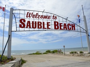 This Sauble Beach sign is a landmark for beach-goers but local officials are advising people to abide by provincial pandemic rules and stay home this long weekend.