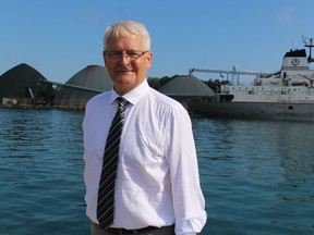 Transport Minister Marc Garneau stands next to Sarnia Harbour Wednesday after announcing $6 million in federal funding for a long-sought $12-million oversized load corridor project for Sarnia and St. Clair Township.