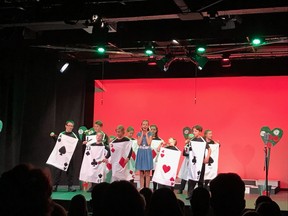 Theatre Woodstock's STAGES summer camp mounted its show of Alice in Wonderland Junior last week. Pictured, Evangeline King as Alice, surrounded by the Playing Cards.