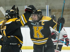 Kingston Jr. Ice Wolves forward Kiara Zanon, left, congratulates defenceman Megan Breen after Breen scored a short-handed goal in the first period of a Provincial Women's Hockey League game against the Southwest Jr. Wildcats of Windsor at the Invista Centre in Kingston on Sept. 20, 2019.