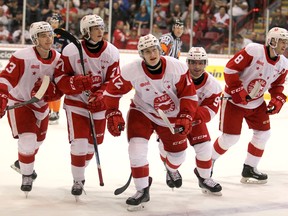 Soo Greyhounds Rory Kerins, Tanner Dickinson, Tye Kartye, Robert Calisti and Jacob LeGuerrier celebrate a goal on Flint Firebirds goalie Anthony Popovich during first-period Ontario Hockey League action at GFL Memorial Gardens on Friday, Sept. 20, 2019 in Sault Ste. Marie, Ont. (BRIAN KELLY/THE SAULT STAR/POSTMEDIA NETWORK)