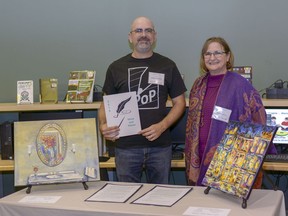 Writer Shane Kroetsch and artist Verone Solilo pose together at the 2019 Voice and Vision gala held at the Airdrie Public Library on Saturday, Sept. 28. The two partnered to work on four unique coinciding pieces.