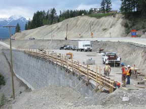 A massive retaining wall was built on a curve to widen the Trans-Canada Highway to four lanes and provide a more stable slope just east of Golden, BC. -- Phase Four -- four kilometres of new highway through the difficult canyon section between the West Portal and Yoho (5-Mile) Bridge. SUPPLIED PHOTO