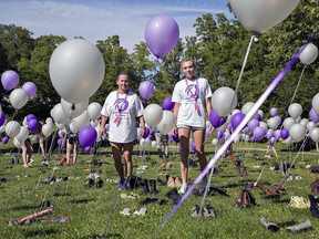 Bekki McGowan (left) of Wilsonville and Ashley McCluskey of Walsingham of Resilient Women's Recovery walk through an art installation representing the number of accidental overdose deaths in Ontario during a four-month period in 2018. The installation was part of an International Overdose Awareness Day in Haldimand-Norfolk, held in Quance Park in Delhi on Saturday. Brian Thompson/Brantford Expositor