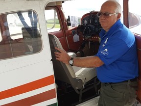 Pilot Marc Dumay performs a pre-flight check during the 2019 COPA (Canadian Owners and Pilots Association) for Kids event. (Trevor Terfloth/Postmedia Network)