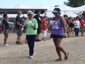 Olive Olbey, 92, and her daughter Michelle Eaton were among the estimated 434 people who took part in the attempt to set the Guinness World Record for the longest Soul Train Line at the annual Homecoming Celebration in North Buxton, Ont., on Monday, Sept. 2, 2019. (Ellwood Shreve/Chatham Daily News)