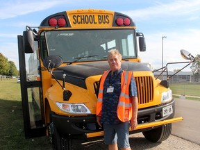 Mike Karelse, a school bus driver and trainer for First Student in Chatham, is seen in front of a school with safety equipment including a rooftop strobe light, GPS, Child Check system and digital video surveillance, which are now mandatory for buses carrying students from the Lambton Kent District Public School and St. Clair Catholic District School Board. (Ellwood Shreve/Chatham Daily News)