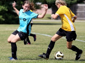 BMO's Annika Tamminga, left, looks back at Zonta Club's Lillian Gosnek-Plante after overrunning the ball during the under-12 girls' final at the Chatham Youth Soccer Association's Day of Champions at Chatham Christian School in Chatham, Ont., on Saturday, Sept. 7, 2019. Mark Malone/Chatham Daily News/Postmedia Network