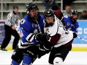 Chatham Maroons' Adrian Stubberfield (51) battles London Nationals' Jacob Chantler (9) in the third period at Chatham Memorial Arena in Chatham, Ont., on Sunday, Sept. 15, 2019. (Mark Malone/Chatham Daily News)