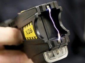 A close up of 50,000 volts arcing between the two terminals of a Taser X26 conductive energy weapon during a conducted energy weapon training session.