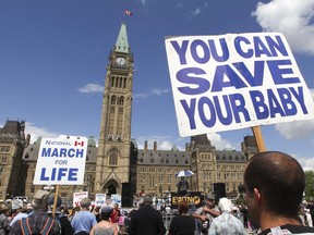 Thousands are seen at Parliament Hill before marching through the streets in Ottawa May 9, 2013 during the March for Life rally. The pro-life movement took over Parliament Hill for the annual rally against abortion.