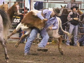 Joe Guze  of Drayton Valley, Alta. missed out on big money at the Hanna Indoor Pro Rodeo, which wrapped up the Canada Pro Rodeo circuit on Sept. 29, after encurring a penalty, leving him with a 14.4 time in steer wrestling. Jackie Irwin/Postmedia