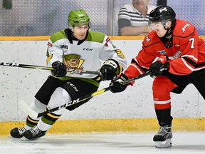 Paul Christopoulos of the North Bay Battalion battles Deni Goure of the Owen Sound Attack.
Sean Ryan Photo