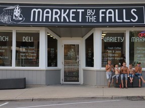 Natasha Oomen, age 13, won the Oxford County Library's teen photography contest in 2019 with this photo of her brothers and cousin eating ice cream outside Market on the Falls in her town of Otterville. The boys pictured from left to right are Jesse, Judah, Johnnes, Gerrit and Marcus. (Courtesy of Natasha Oomen/Oxford County Library)