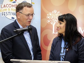 Current Minister of Culture Ron Orr, left, talks about Alberta Culture Days alongside then Minister of Culture, Multiculturalism and Status of Women Leela Aheer during her visit to the Lacombe Ag Grounds in Lacombe, Alta. during the Lacombe Culture and Harvest Festival on Sunday Sept. 29, 2019.