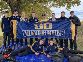 Members of the Laurentian University men's cross-country team display their banner. Pictured left to right are (front row) Eric Gareau, Keon Wallingford, (back row) Adam Kalab, Paul Sagriff, Liam Passi, Maurice Graenert, Alexandre Fishbein-Ouimette, Caleb Beland, Nick Lambert and coach Darren Jermyn.