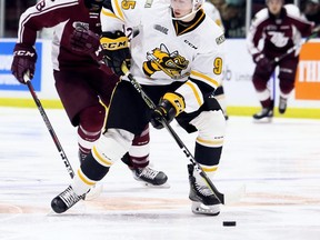 Sarnia Sting's Justin Nolet (95) carries the puck away from Peterborough Petes' Max Grondin (28) in the second period at Progressive Auto Sales Arena in Sarnia, Ont., on Friday, Oct. 11, 2019. (Mark Malone/Chatham Daily News/Postmedia Network)