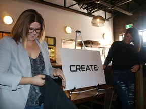 Leslie Thompson and Martha Woods unveil the new CREATE logo at the Cornwall Innovation Centre relaunch party  on Friday October 25, 2019 in Cornwall, Ont. Alan S. Hale/Cornwall Standard-Freeholder/Postmedia Network