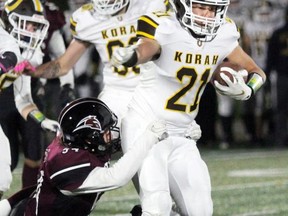 PETER RUICCI   

Korah running back Zac Zeppa tries to pull away from St. Mary's defender Matt Boston in the 2019 High School Senior Football League final. Korah won the game 42-3.