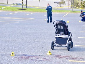 Greater Sudbury Police collect evidence outside the Michaels store at Silver Hills last year, after a woman and her child were injured in an attack by a man with knife.