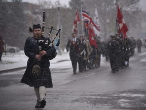 Piper Dylan Powell leads the Remembrance Day procession to the cenotaph in Victoria Park on Monday during the city's annual Remembrance Day ceremonies. (Kathleen Saylors/Woodstock Sentinel-Review)