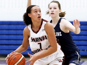 Northern Vikings' Jamilah Dent (7) is defended by Ursuline Lancers' Zayda Sprik (3) during the LKSSAA 'AAA' senior girls' basketball final at Lambton College in Sarnia, Ont., on Saturday, Nov. 9, 2019. Mark Malone/Chatham Daily News/Postmedia Network
