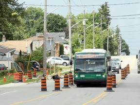 A city bus makes its way through a construction zone on Mill Street in Woodstock, Ont. last summer. City council will discuss a potential change from six to seven bus routes during the 2020 budget talks. (Greg Colgan/Woodstock Sentinel-Review)