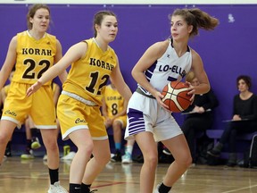 Esther Yule (left) and Amy May of the Korah Colts defend against Isabel Maki of Sudbury's Lo-Ellen Knights during NOSSA senior girls basketball semifinal action last November in Sudbury.