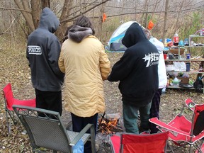 This group of homeless people are seen around a fire in a file photo taken in November 2019. A community-led effort is being made to help provide permanent housing, with supports to address this issue of homeless in Chatham-Kent. (Ellwood Shreve/Chatham Daily News)