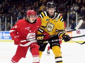 Soo Greyhounds' Tanner Dickinson (71) and Sarnia Sting's Ryan McGregor (19) chase the puck in the second period at Progressive Auto Sales Arena in Sarnia, Ont., on Friday, Nov. 8. 2019. Mark Malone/Chatham Daily News/Postmedia Network